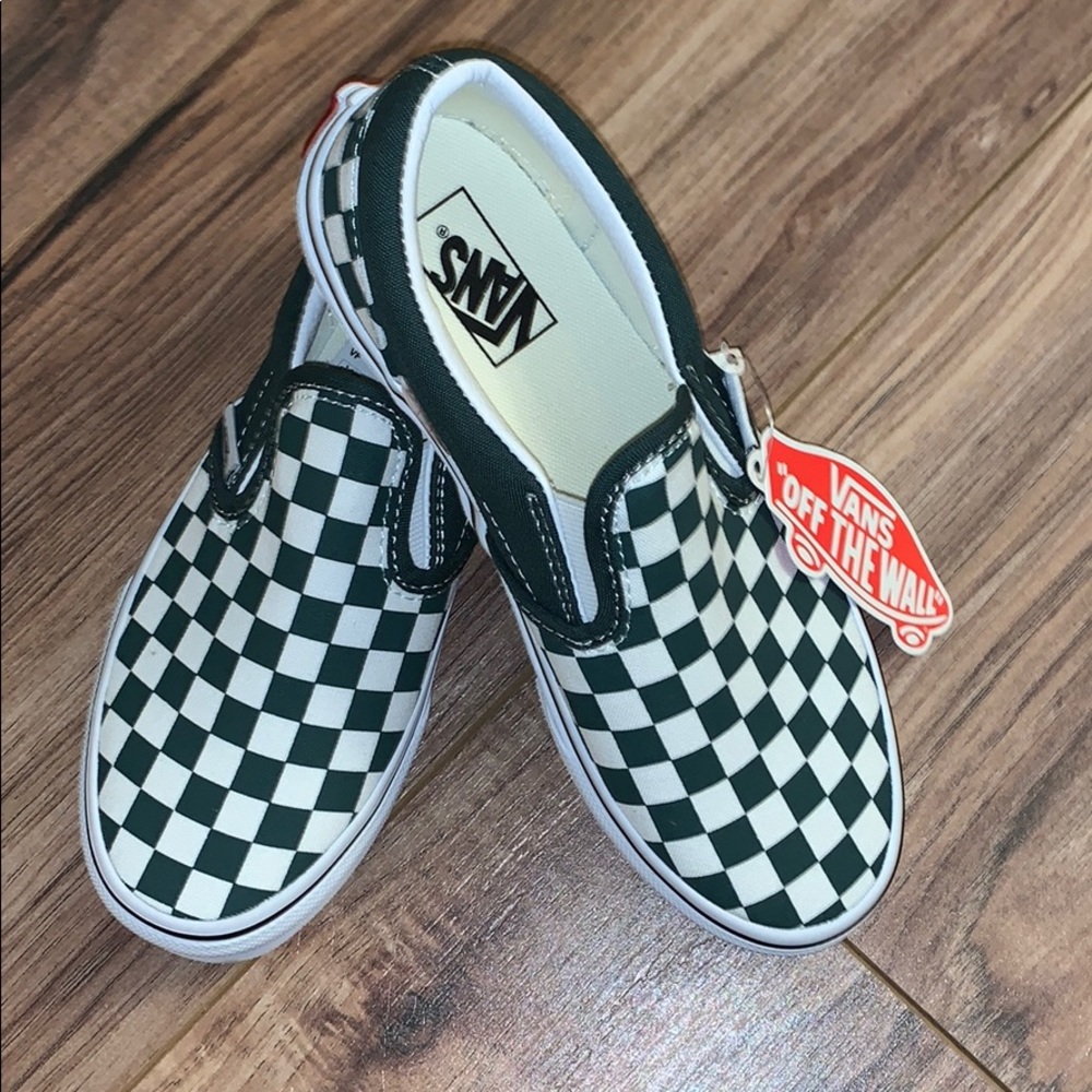 Dark green checkered slip on Vans.